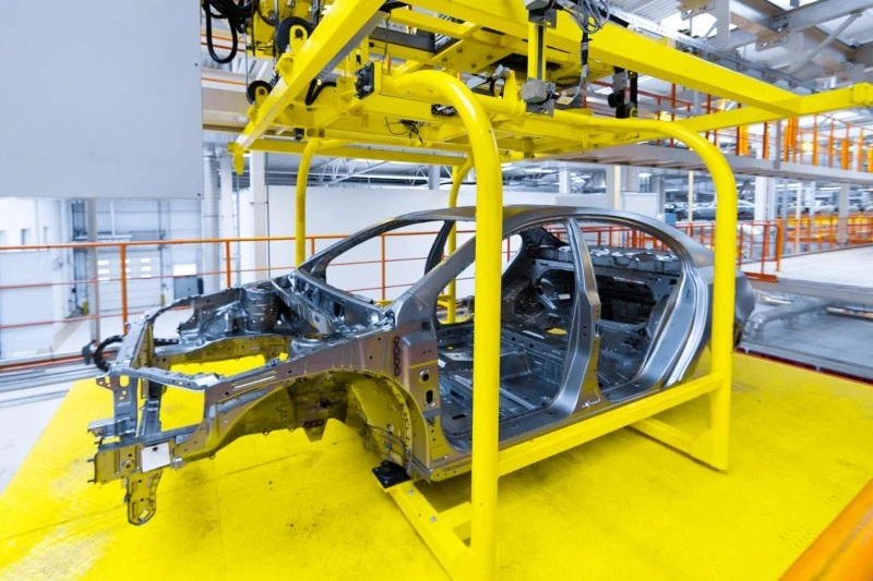 A structural automotive sub-frame component replacing stamped steel A structural automotive sub-frame component replacing stamped steel